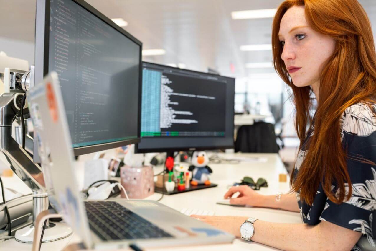 Women infront of laptop with web development programming