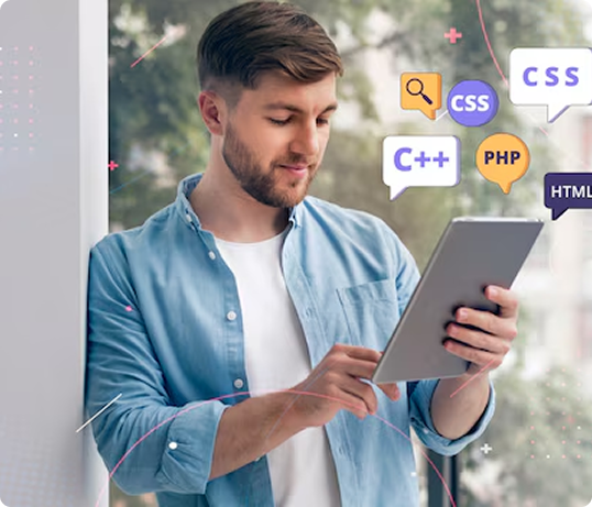 Man using a tablet with coding icons
